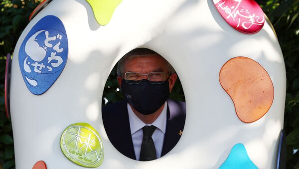 International Olympic Committee (IOC) President Thomas Bach poses with a Tokyo 2020 recovery monument as he visits the monuments next to the National Stadium, the main stadium of Tokyo 2020 Olympic and Paralympic Games, in Tokyo , Japan, August 1, 2021. - Sputnik International