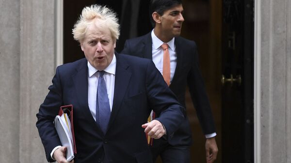Britain's Prime Minister Boris Johnson (L) and Britain's Chancellor of the Exchequer Rishi Sunak (R) leave 10 Downing Street to attend the weekly cabinet meeting in London on October 13, 2020 held at the Foreign, Commonwealth and Development Office - Sputnik International