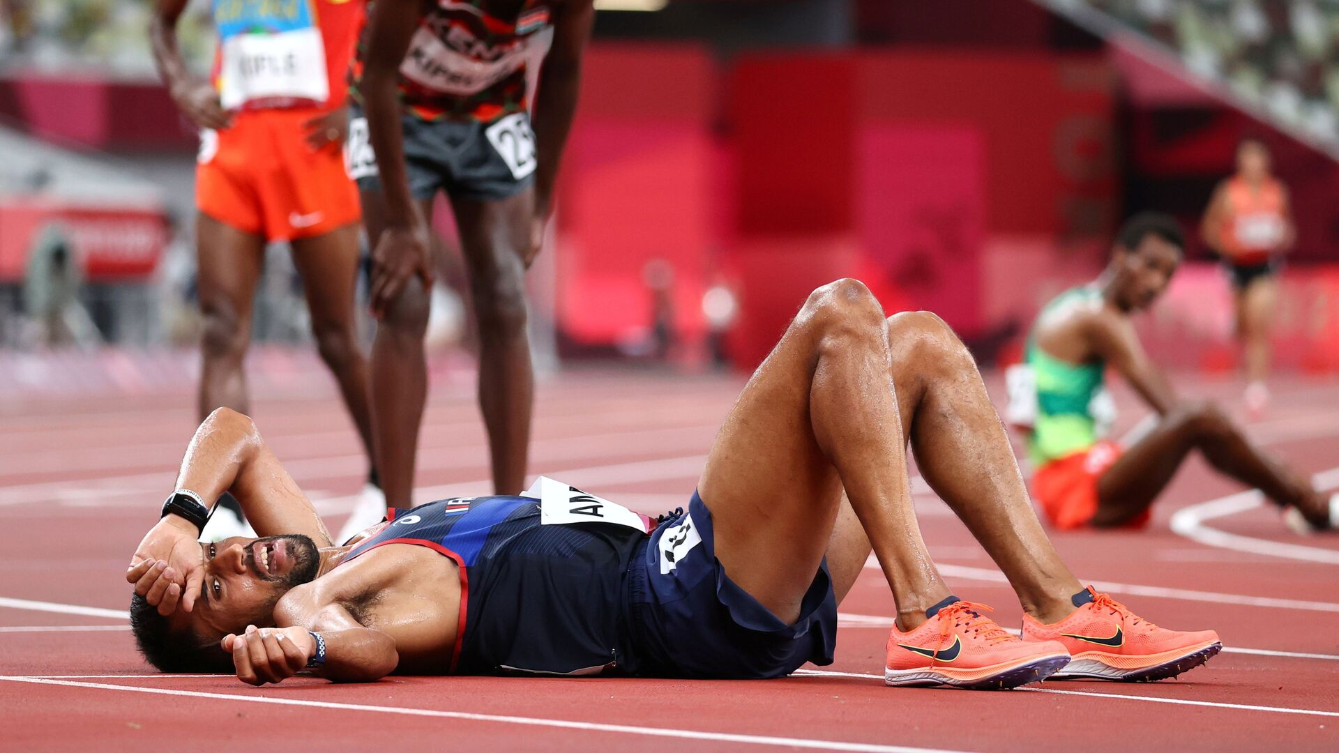 Tokyo 2020 Olympics - Athletics - Men's 10000m - OLS - Olympic Stadium, Tokyo, Japan - July 30, 2021. Morhad Amdouni of France reacts after competing in the final REUTERS/Lucy Nicholson - Sputnik International, 1920, 07.09.2021