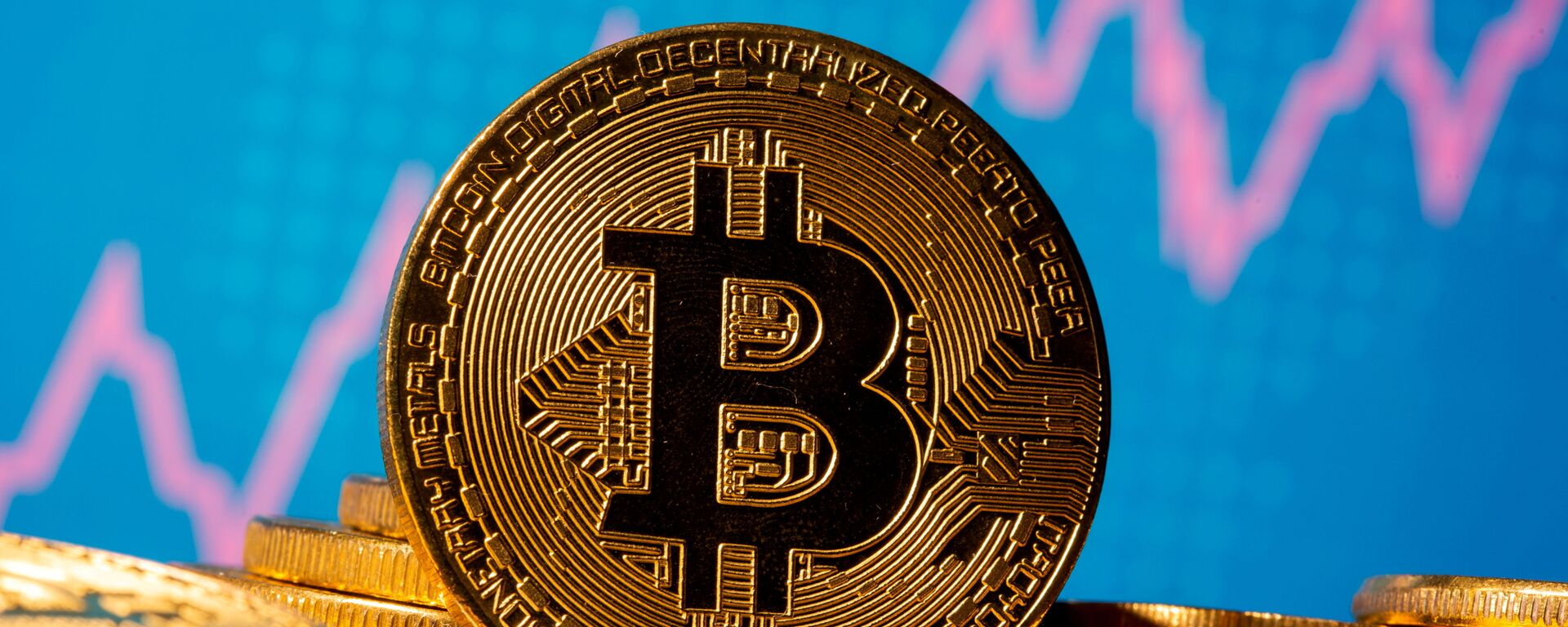 FILE PHOTO: A representation of virtual currency bitcoin is seen in front of a stock graph in this illustration taken November 19, 2020. REUTERS/Dado Ruvic/Illustration/File Photo - Sputnik International, 1920, 23.08.2021