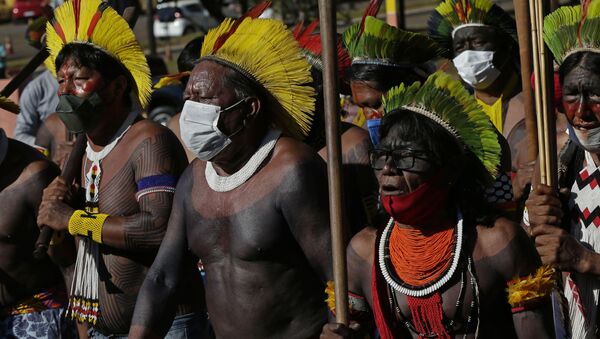 Indigenous people march to the entrance of the Chamber of Deputies to protest against Brazilian President Jair Bolsonaro's proposals to allow mining on Indigenous lands in Brasilia, Brazil, Wednesday, June 16, 2021 - Sputnik International