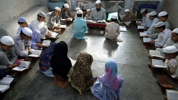 Muslim students from remote hilly areas of Jammu study inside a madrasa, or religious school, on the outskirts of Jammu, India, Saturday, July 1, 2006 - Sputnik International