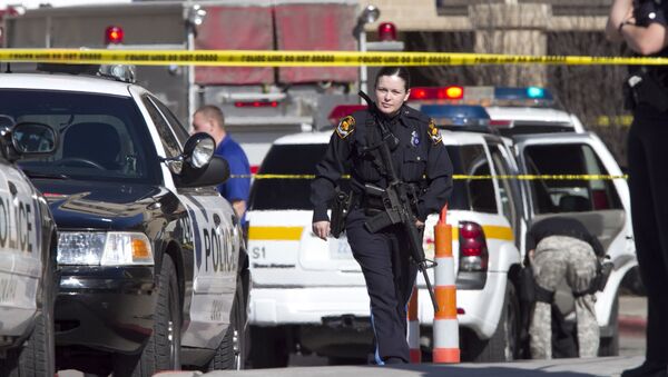  An armed police officer walking in a roped off area , in Omaha, Neb (File) - Sputnik International