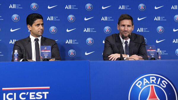 Lionel Messi, right, and PSG president Nasser Al-Al-Khelaifi attend a press conference Wednesday, Aug. 11, 2021 at the Parc des Princes stadium in Paris.  - Sputnik International
