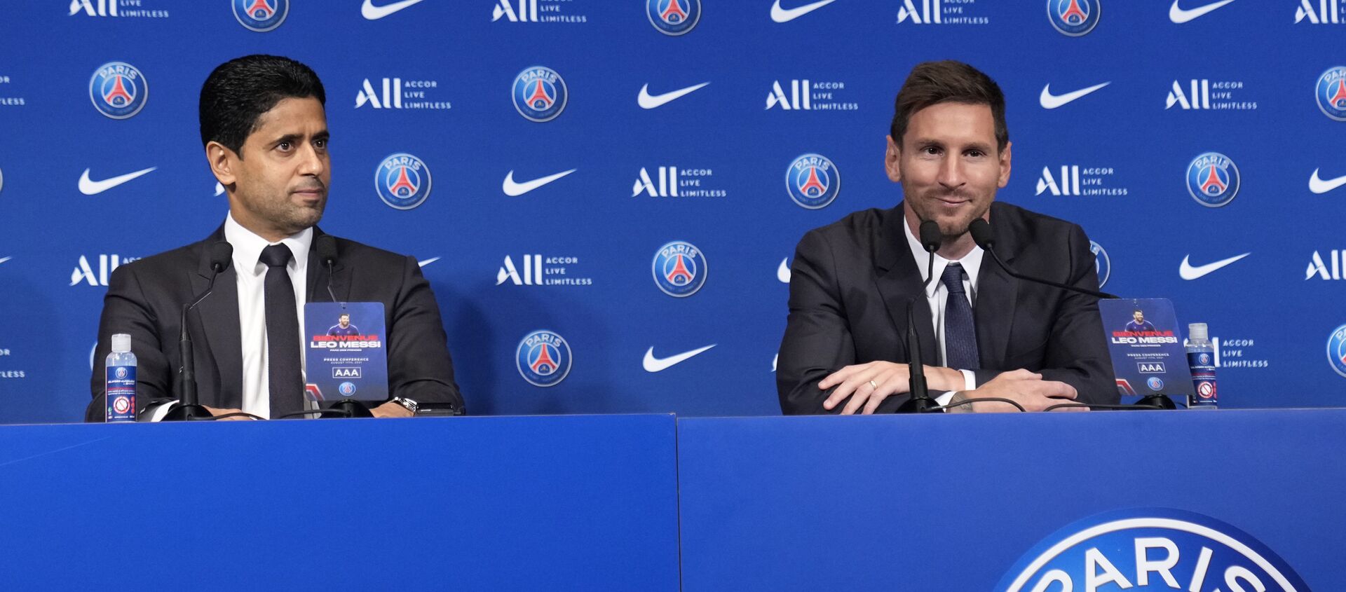 Lionel Messi, right, and PSG president Nasser Al-Al-Khelaifi attend a press conference Wednesday, Aug. 11, 2021 at the Parc des Princes stadium in Paris.  - Sputnik International, 1920, 11.08.2021