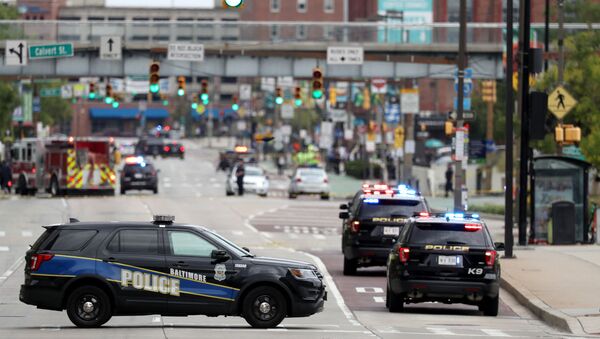 Baltimore City police vehicles block off Pratt Street near the Transamerica Building as officials are investigating a suspicious van in a parking garage on September 09, 2019 in Baltimore, Maryland. - Sputnik International