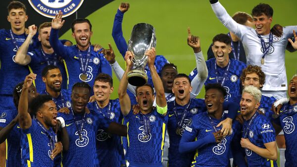 Soccer Football - European Super Cup - Chelsea v Villarreal - Windsor Park, Belfast, Northern Ireland - August 11, 2021 Chelsea's Cesar Azpilicueta and teammates celebrate with the trophy after winning the penalty shoot-out and the European Super Cup - Sputnik International