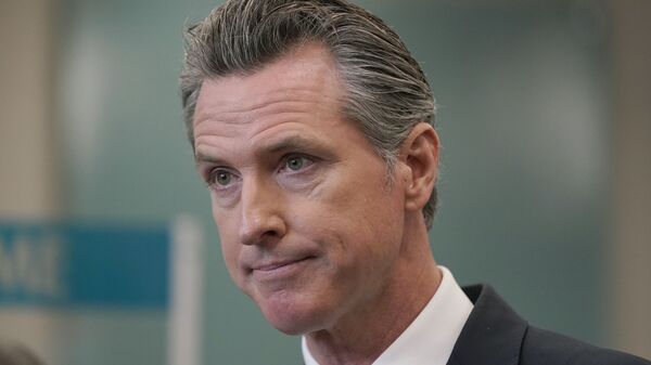 FILE — In this July 26, 2021, file photo, Gov. Gavin Newsom appears at a news conference in Oakland, Calif. Supporters of the effort to recall Newsom are asking a court to prohibit him from calling the effort sRepublican recall in the state's official voter guide. The lawsuit was filed by July 30, 2021, by Orrin Heatlie, the Republican activist who launched the recall effort. - Sputnik International