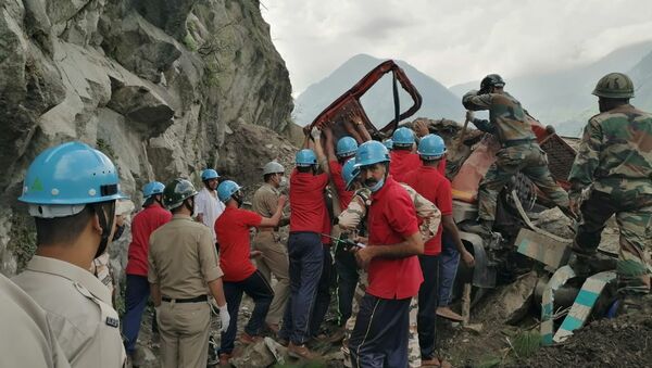 Indo-Tibetan Border Police (ITBP) personnel remove a damaged truck during a rescue operation at the site of a landslide in Kinnaur district in the northern state of Himachal Pradesh, India, August 11, 2021 - Sputnik International