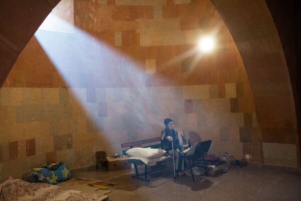 An elderly woman sits inside a bomb shelter in the Nagorno-Karabakh region, Azerbaijan. - Sputnik International