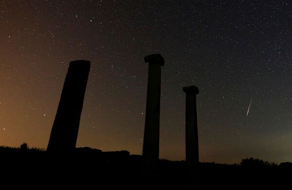 A long exposure shot shows stars and meteors over the columns in the ancient city of Stobi, near Stip, North Macedonia, 12 August 2021.  - Sputnik International