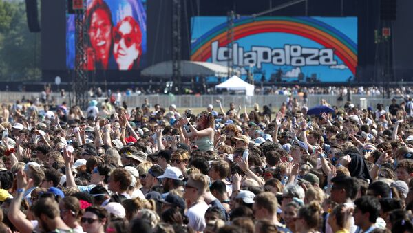 In this July 29, 2021 file photo, fans gather and cheer on day one of the Lollapalooza music festival at Grant Park in Chicago. Chicago health officials on Thursday, Aug. 12, 2021, reported 203 cases of COVID-19 connected to Lollapalooza, casting it as a number that was anticipated and not yet linked to any hospitalizations or deaths - Sputnik International