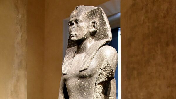 Praying statue of Amenemhat III. The back pillar is inscribed with a hieroglyphic text with the cartouches of the pharaoh. From Memphis, Egypt. Middle Kingdom, 12th Dynasty, c. 1840-1800 BCE. Neues Museum, Berlin, Germany. Dolerite, ÄM 1121 - Sputnik International