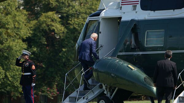 US President Joe Biden makes his way to board Marine One before departing from Fort McNair in Washington, DC on August 12, 2021. - Biden is heading to his residence in Wilmington, Delaware. - Sputnik International