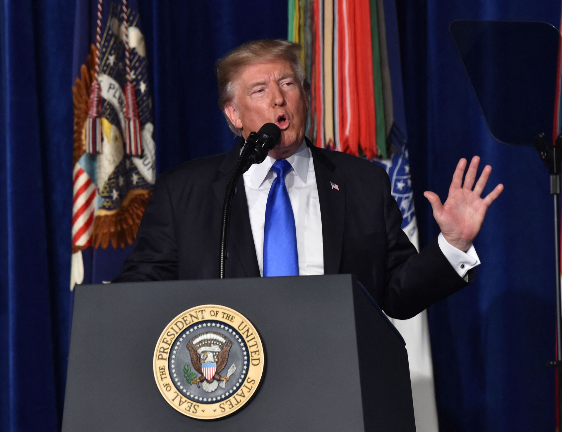 US President Donald Trump speaks during his address to the nation from Joint Base Myer-Henderson Hall in Arlington, Virginia, on August 21, 2017. - Trump Monday left the door open to a possible political agreement with the Taliban, in an address to the nation on America's strategy in the 16-year Afghan conflict. Some day, after an effective military effort, perhaps it will be possible to have a political sentiment that includes elements of the Taliban in Afghanistan, he said. - Sputnik International, 1920, 07.09.2021