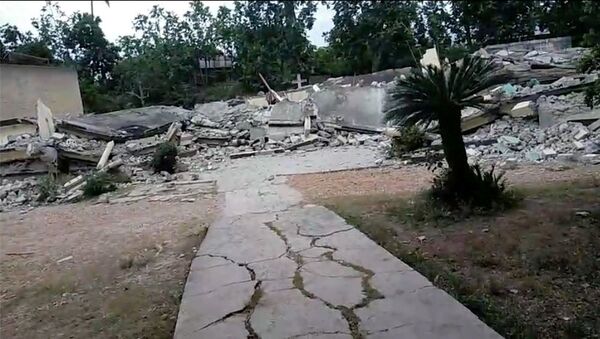 Damage is seen in an area after a major earthquake struck southwestern Haiti, in Latiboliere, Jeremie, Haiti August 14, 2021, in this still image obtained from video - Sputnik International