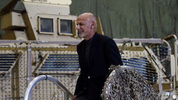 Afghan's President Ashraf Ghani walks on stage to address US troops during a surprise Thanksgiving day visit of US President Donald Trump at Bagram Air Field, on November 28, 2019 in Afghanistan.  - Sputnik International
