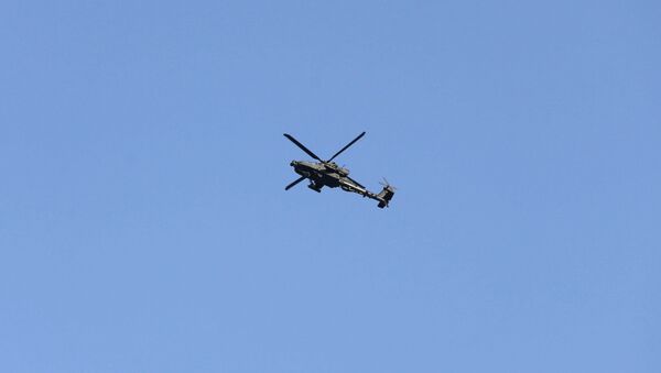 Army Apache helicopter flies over Kabul, Afghanistan August 15, 2021. REUTERS/Stringer - Sputnik International