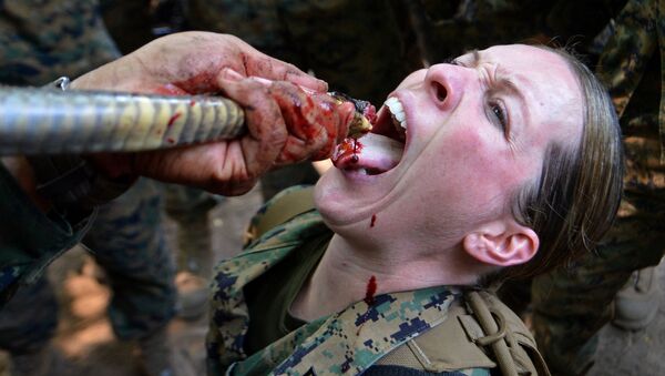 A US Marine drinks cobra blood during a jungle survival program as part of the annual combined military exercises, Cobra Gold 2013, at a navy base in Sattahip on February 20, 2013 - Sputnik International