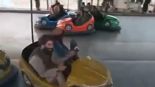 Screenshot: Alleged Taliban militants in an amusement park - Sputnik International
