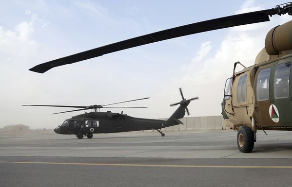 In this Monday 19 March 2018 photo, a UH-60 Black Hawk helicopter carrying US advisers and Afghan trainees take off at Kandahar Air Field, Afghanistan.  - Sputnik International