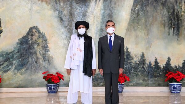 Chinese State Councilor and Foreign Minister Wang Yi meets with Mullah Abdul Ghani Baradar, political chief of Afghanistan's Taliban, in Tianjin, China July 28, 2021. Picture taken July 28, 2021. - Sputnik International