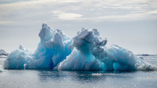 FILE PHOTO: An iceberg floats in a fjord near Tasiilaq, Greenland, June 16, 2018.  - Sputnik International