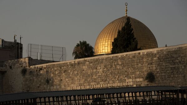 The Dome of the Rock mosque is seen above the Mughrabi Bridge, a wooden pedestrian bridge connecting the wall to the Al Aqsa Mosque compound, in Jerusalem's Old City, Tuesday, July 20, 2021. - Sputnik International