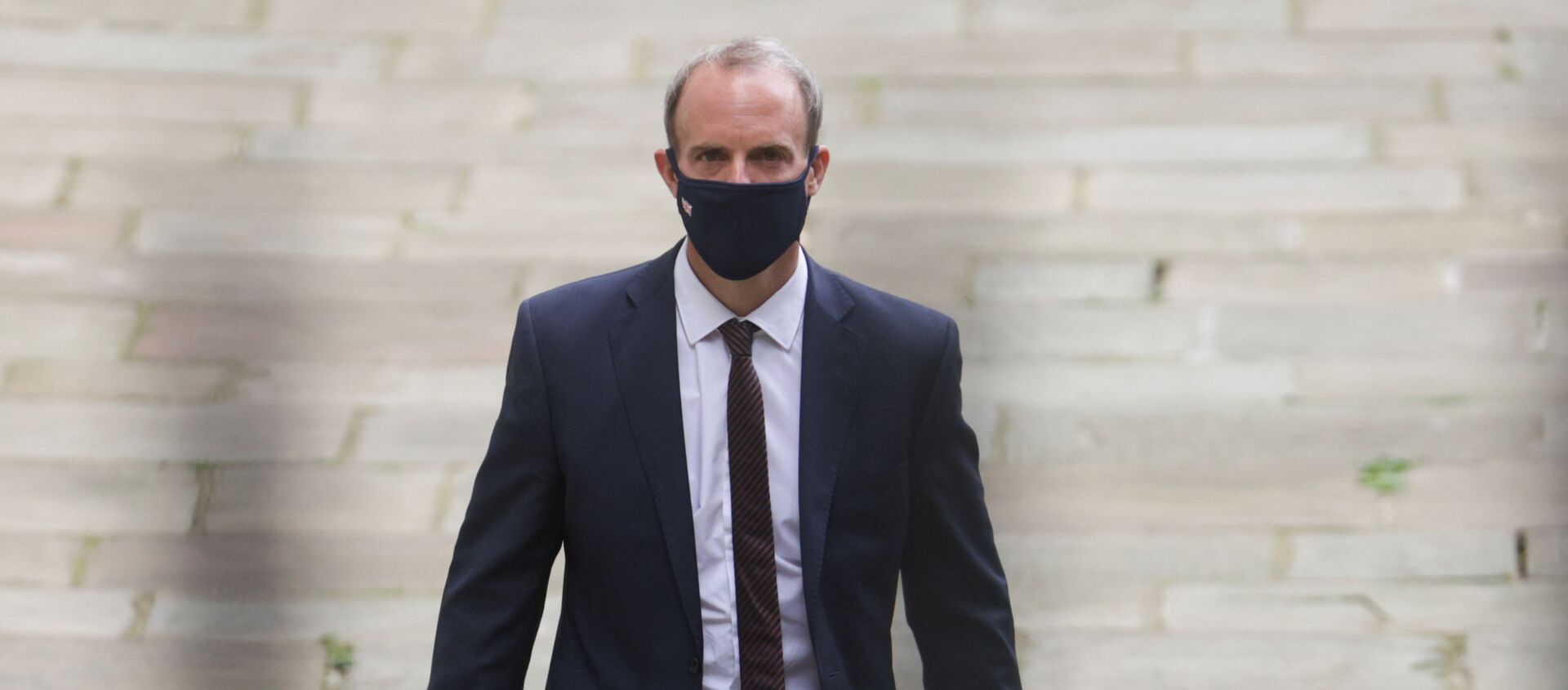 Britain's Foreign Secretary Dominic Raab walks outside Downing Street, in London, Britain, August 16, 2021 Britain's Foreign Secretary Dominic Raab walks outside Downing Street, in London, Britain, August 16, 2021 - Sputnik International, 1920, 22.08.2021