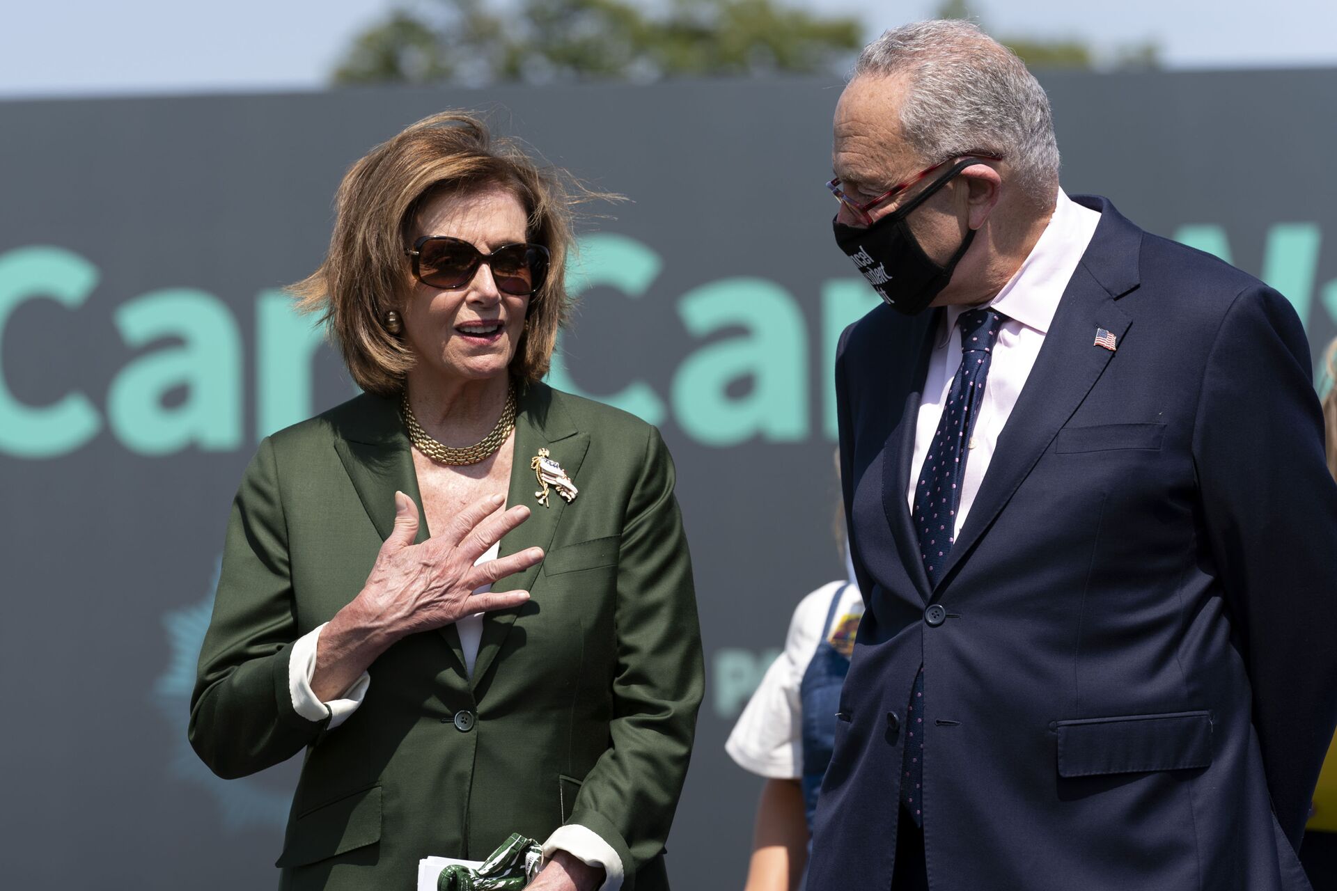 Speaker of the House Nancy Pelosi, D-Calif., speaks with Senate Majority Leader Chuck Schumer, D-N.Y., during Paid Leave for All rally on Capitol Hill in Washington, Wednesday, Aug. 4, 2021. - Sputnik International, 1920, 29.09.2021