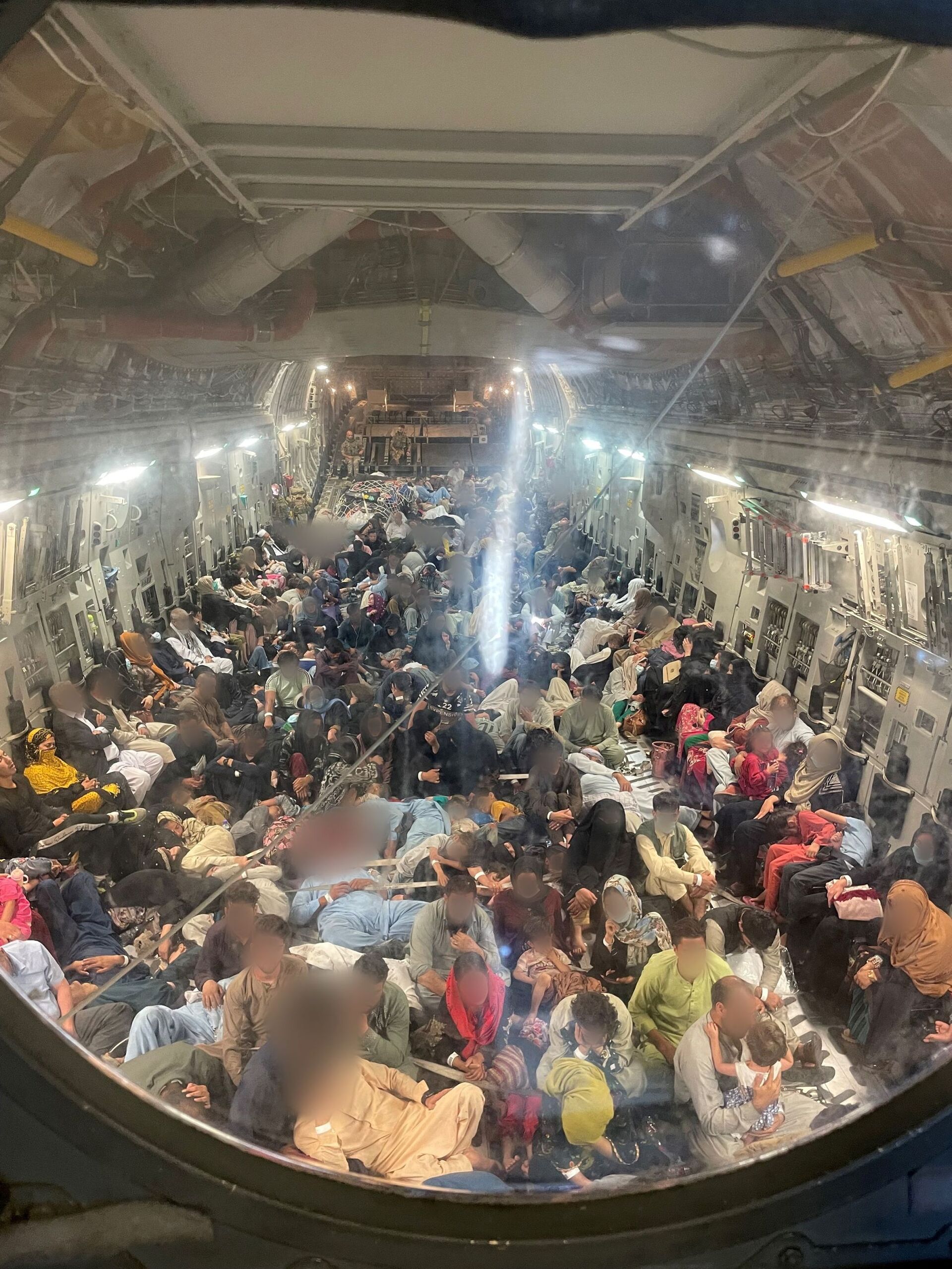 Passengers sit inside a Royal Air Force C-17 following evacuation from Kabul airport, Afghanistan, in this photo taken at undisclosed location and released on August 22, 2021 - Sputnik International, 1920, 07.09.2021
