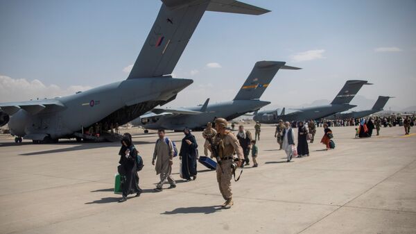 Members of the UK Armed Forces continue to take part in the evacuation of entitled personnel from Kabul airport, in Kabul, Afghanistan August 19-22, 2021, in this handout picture obtained by Reuters on August 23, 2021. LPhot Ben Shread/UK MOD Crown copyright 2021/Handout via REUTERS  THIS IMAGE HAS BEEN SUPPLIED BY A THIRD PARTY. MANDATORY CREDIT. NO RESALES. NO ARCHIVES. - Sputnik International