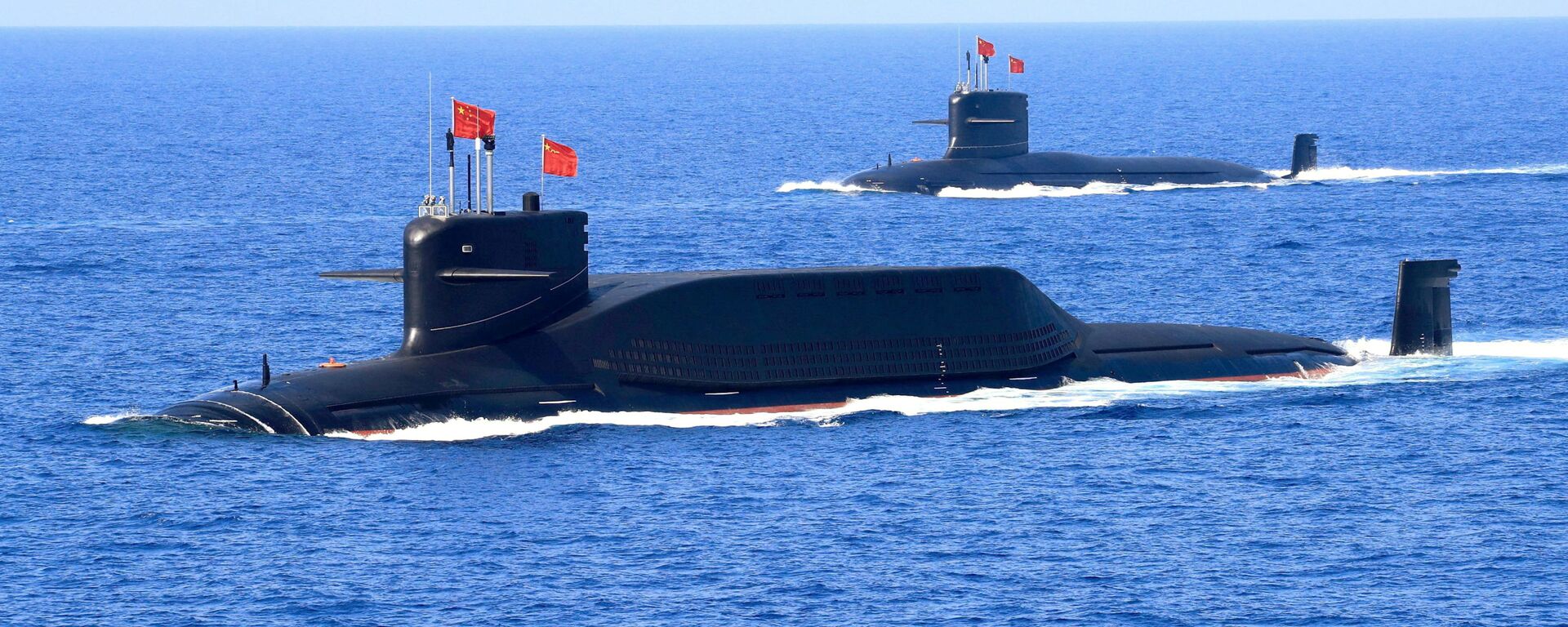 A nuclear-powered Type 094A Jin-class ballistic missile submarine of the Chinese People's Liberation Army (PLA) Navy is seen during a military display in the South China Sea April 12, 2018 - Sputnik International, 1920, 18.09.2021