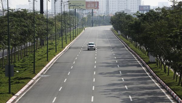 A lone car is seen on an empty highway during lockdown amid the coronavirus disease (COVID-19) pandemic in Ho Chi Minh, Vietnam August 23, 2021.  - Sputnik International