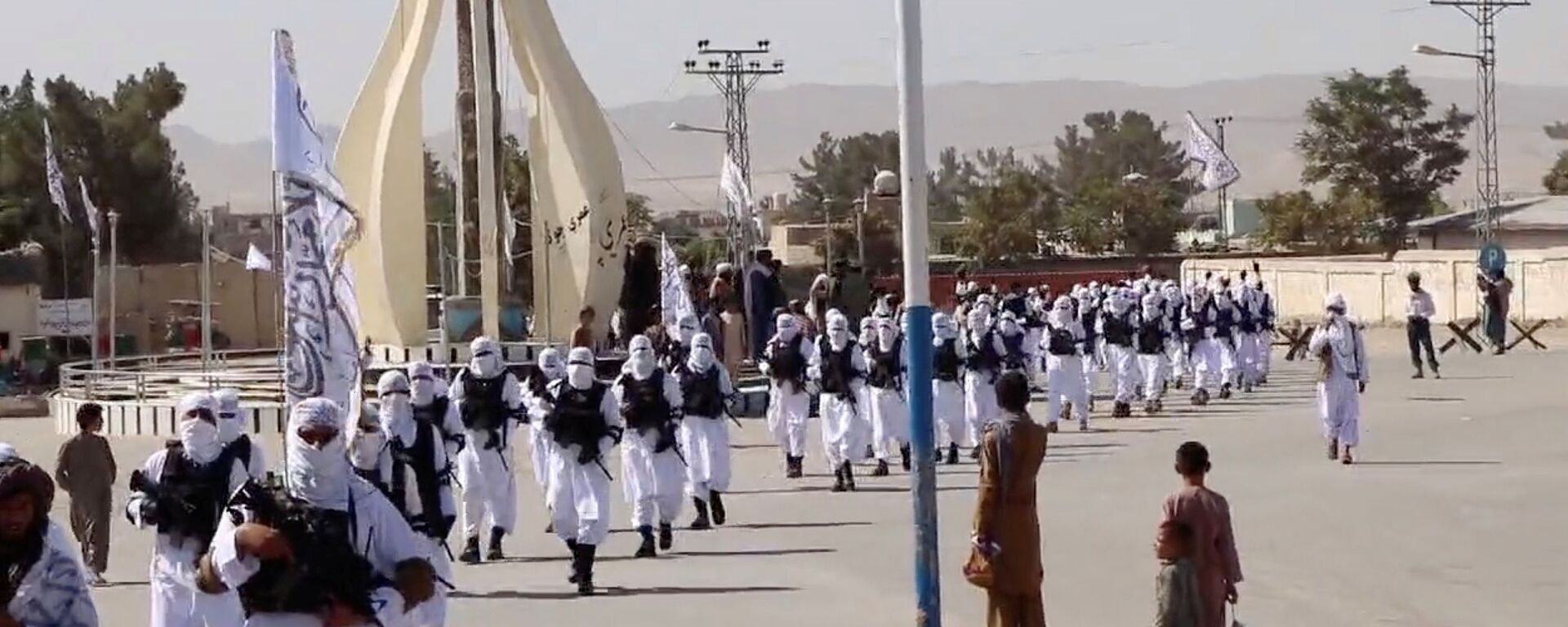 Taliban fighters march in uniforms on the street in Qalat, Zabul Province, Afghanistan, in this still image taken from social media video uploaded August 19, 2021 and obtained by REUTERS - Sputnik International, 1920