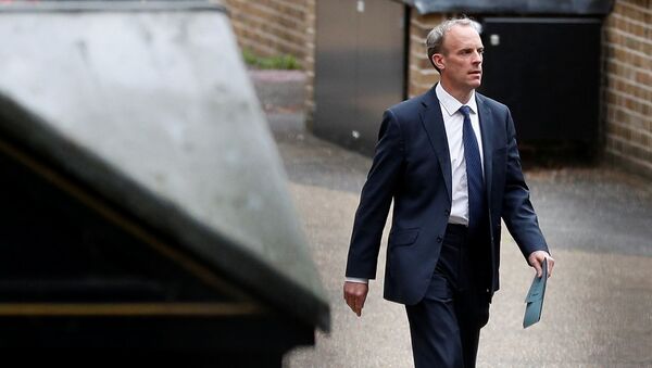 Britain's Foreign Secretary Raab walks outside the Foreign, Commonwealth and Development Office in London - Sputnik International