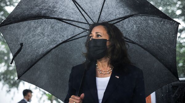 US Vice President Kamala Harris looks on as she lays flowers at the Senator John McCain memorial site, where his Navy aircraft was shot down by the North Vietnamese, on the three-year anniversary of his death, in Hanoi, Vietnam, August, 25, 2021. - Sputnik International