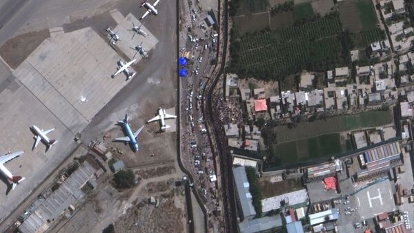 An overview of crowds at the Abbey Gate at Hamid Karzai International Airport, in Kabul, Afghanistan August 24, 2021, in this satellite image obtained by Reuters on August 26, 2021 - Sputnik International