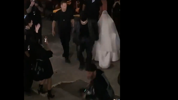 Screenshot from a video showing Kanye West and Kim Kardashian walking together after the Donda listening event - Sputnik International
