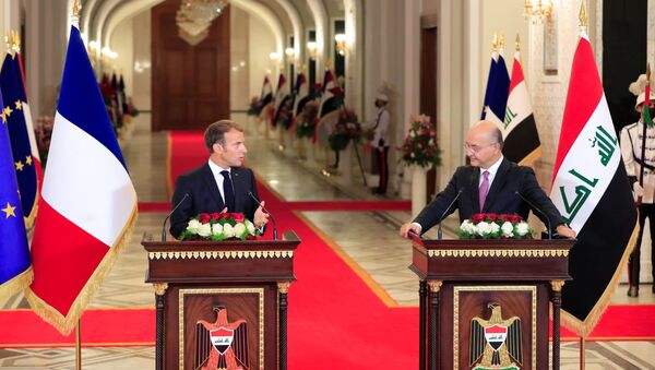 Iraq's President Barham Salih and France's President Emmanuel Macron attend a news conference ahead of the Baghdad summit at the Green Zone in Baghdad, Iraq August 28, 2021 - Sputnik International