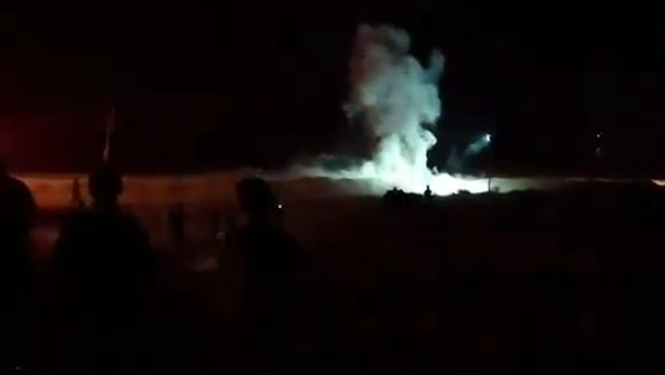 Screenshot from a video allegedly showing an explosion occurring east of Gaza City during night border protests on Saturday - Sputnik International