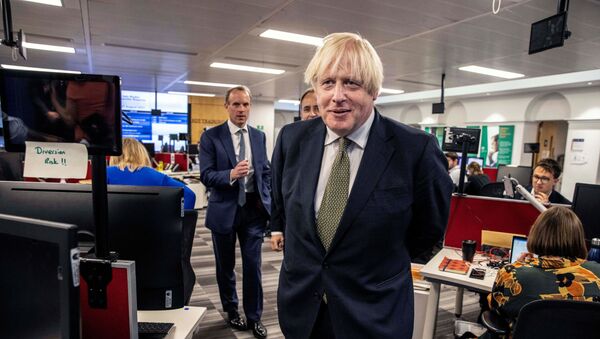 Britain's Prime Minister Boris Johnson and Britain's Foreign Secretary Dominic Raab visit the The Foreign, Commonwealth and Development Office (FCDO) Crisis Centre in London, Britain August 27, 2021. - Sputnik International