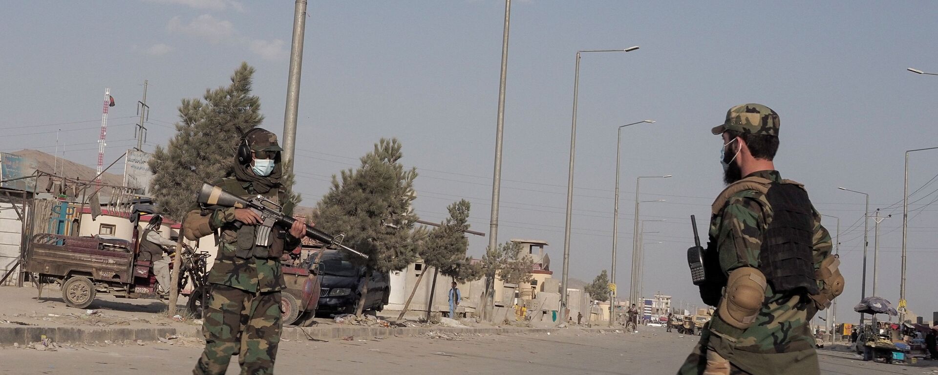 Taliban fighters guard a street leading to the Hamid Karzai International Airport in Kabul, Afghanistan August 29, 2021 - Sputnik International, 1920