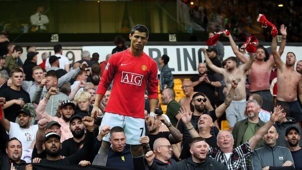 Manchester United fans hold a cutout of Cristiano Ronaldo during the game at Wolves on Sunday 29 August 2021 - Sputnik International