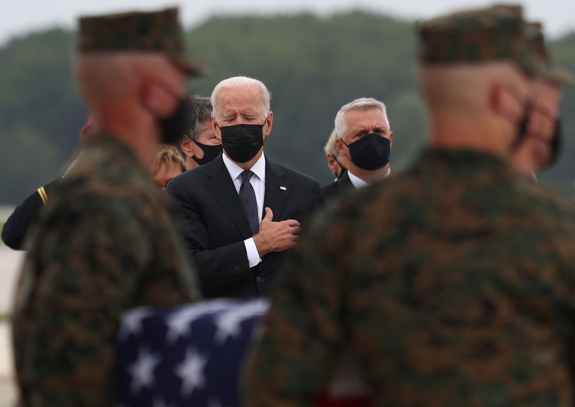 U.S. President Joe Biden honors the dignified transfer of the remains of U.S. military service members who were killed by an August 26 suicide bombing at Kabul's Hamid Karzai International Airport, at Dover Air Force Base in Dover, Delaware, U.S., August 29, 2021. REUTERS/Tom Brenner - Sputnik International, 1920, 07.09.2021
