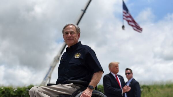 Texas Governor Greg Abbott exits the stage with former U.S. President Donald Trump after a visit to an unfinished section of the wall along the U.S.-Mexico border in Pharr, Texas, U.S. June 30, 2021. - Sputnik International