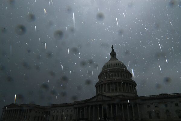 Raindrops are illuminated by a camera flash as Hurricane Ida passes over the region, at the US Capitol in Washington, US, 1 September 2021.   - Sputnik International
