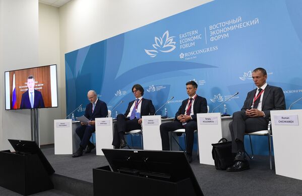 Participants of the Russia-Japan business dialogue at the Eastern Economic Forum in Vladivostok. From right to left: co-owner and President of TECHNONICOL Sergey Kolesnikov, CEO of Platform for Supporting Japanese Investments in the Far East Alexey Khachai, CEO of Sollers Group Vadim Shvetsov, founder and chairman of the board of directors of AEON Corporation Roman Trotsenko. Left on the screen: Russian Economic Development Minister Maxim Reshetnikov. - Sputnik International