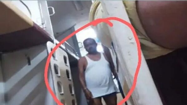 The picture shows Gopal Mandal roaming around the AC coach of the Tejas Express from Patna to Delhi. When passengers objected to the Member of the Legislative Assembly's state of undress, Gopal Mandal is said to have threatened to shoot them. - Sputnik International
