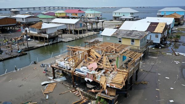 Homes destroyed in the wake of Hurricane Ida are shown September 2, 2021 in Grand Isle, Louisiana. Ida made landfall August 29 as a Category 4 storm near Grand Isle, southwest of New Orleans, causing widespread power outages, flooding and massive damage.   - Sputnik International